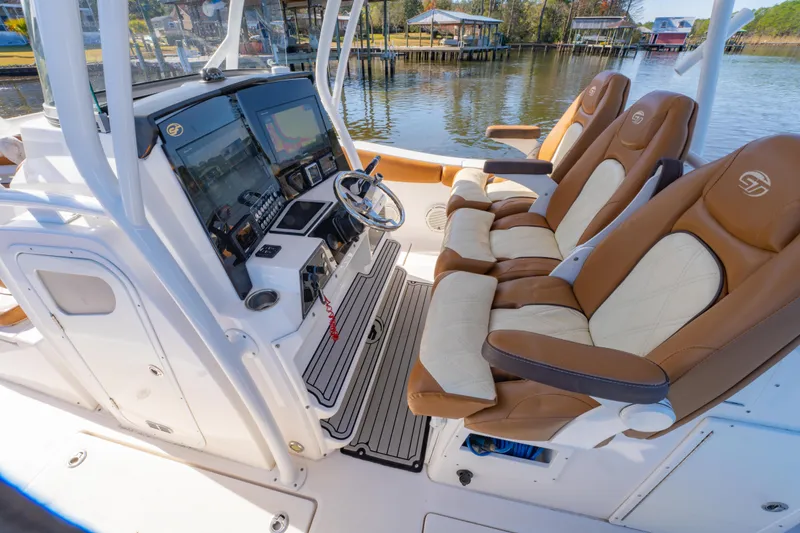 Slide: The Image of 2019 Sea Fox 328 Commander boat interior with helm and luxurious seating. - 21