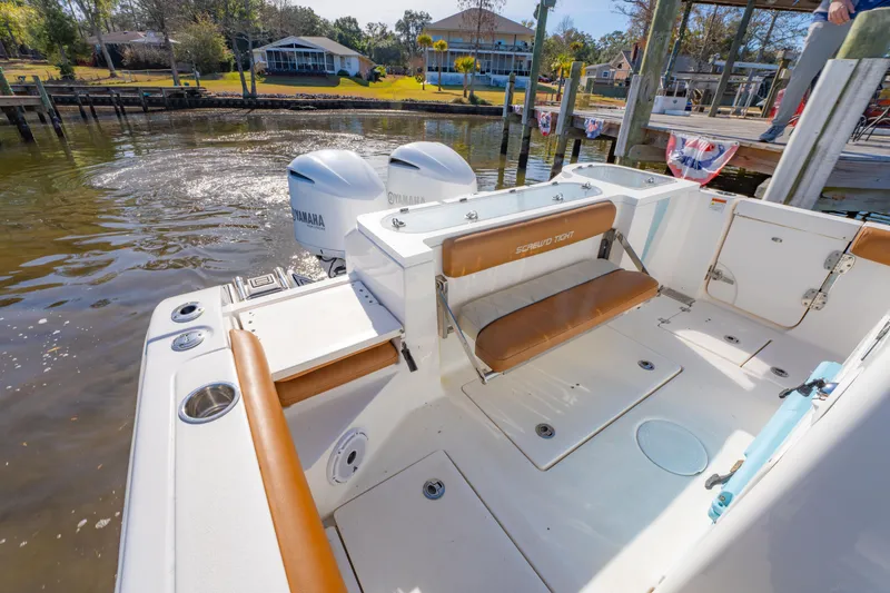 Slide: The Image of 2019 Sea Fox 328 Commander boat with Yamaha engines docked by a lakeside. - 26