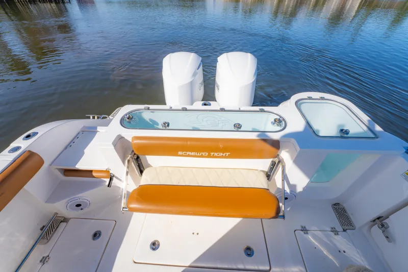 Slide: The Image of 2019 Sea Fox 328 Commander boat with dual engines and seating, on calm water. - 28