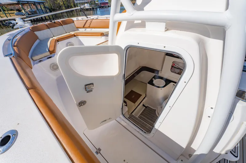 Slide: The Image of 2019 Sea Fox 328 Commander boat interior with open hatch and seating area. - 39