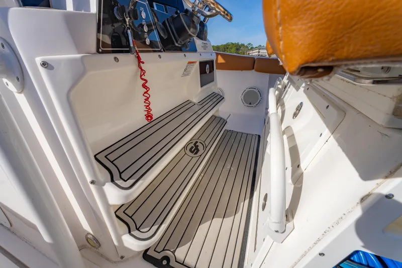 Slide: The Image of 2019 Sea Fox 328 Commander boat interior with striped flooring and control panel. - 41