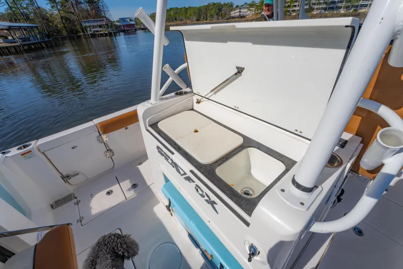 Slide: The Image of 2019 Sea Fox 328 Commander boat with open storage compartment on deck. - 43