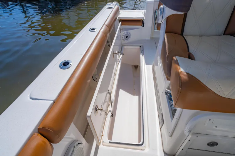 Slide: The Image of 2019 Sea Fox 328 Commander boat interior with storage compartment and cushioned seating. - 44