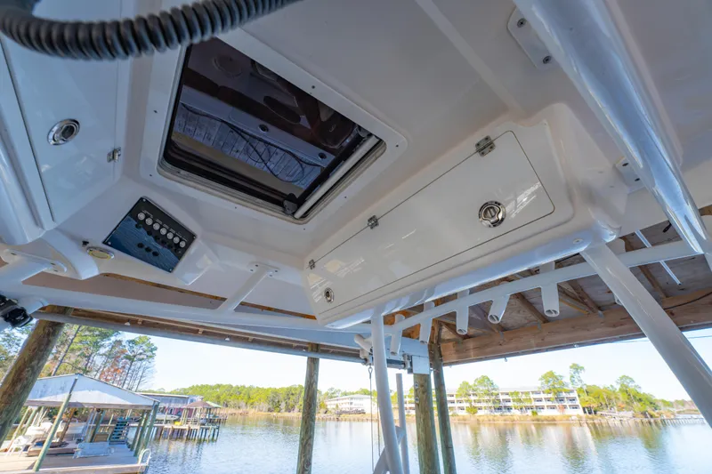 Slide: The Image of 2019 Sea Fox 328 Commander boat interior with hatch and control panel, dockside view. - 47