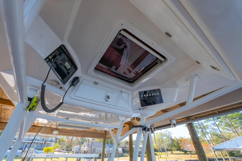 Slide: The Image of 2019 Sea Fox 328 Commander boat interior with control panel and hatch. - 48