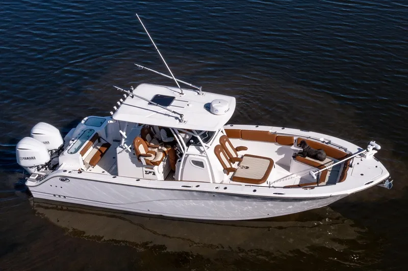 Slide: The Image of 2019 Sea Fox 328 Commander boat with Yamaha engines on calm water. - 5