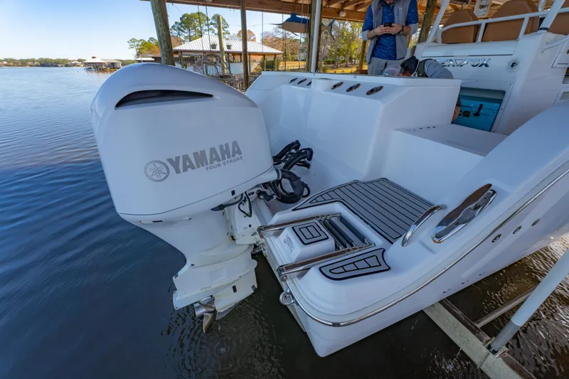 Slide: The Image of 2019 Sea Fox 328 Commander with Yamaha outboard engine, docked by the water. - 50
