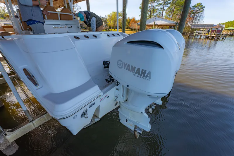 Slide: The Image of 2019 Sea Fox 328 Commander with Yamaha outboard motor docked by the water. - 51