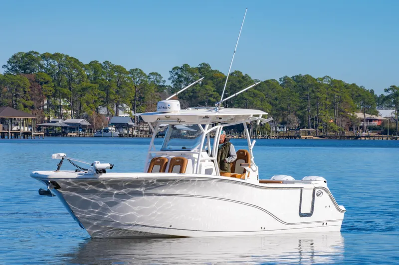 Slide: The Image of 2019 Sea Fox 328 Commander boat on calm water with scenic background. - 7