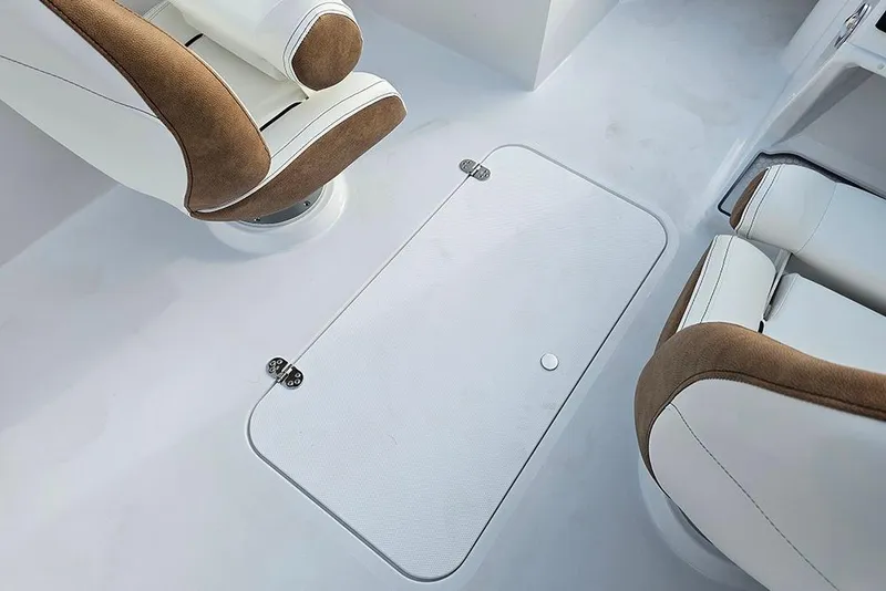 Slide: The Image of 2026 Stingray 191 DC boat interior with storage compartments and seating. - 12