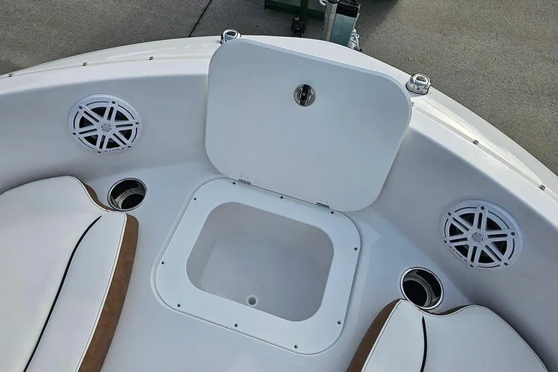 Slide: The Image of 2026 Stingray 191 DC boat interior with white cushioned seating and stainless steel accents. - 22