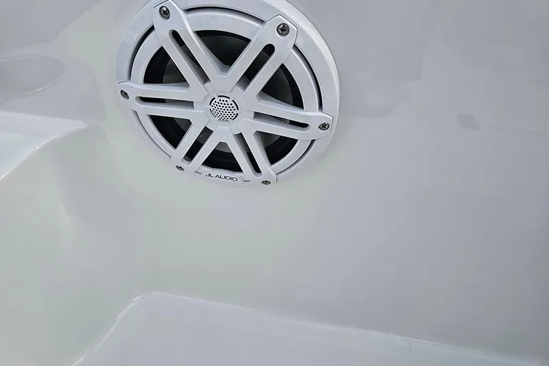 Slide: The Image of 2026 Stingray 191 DC boat interior with white and brown seating, sleek design. - 26