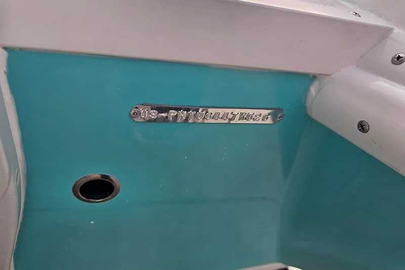 Slide: The Image of 2026 Stingray 191 DC boat hull identification number on turquoise surface. - 28