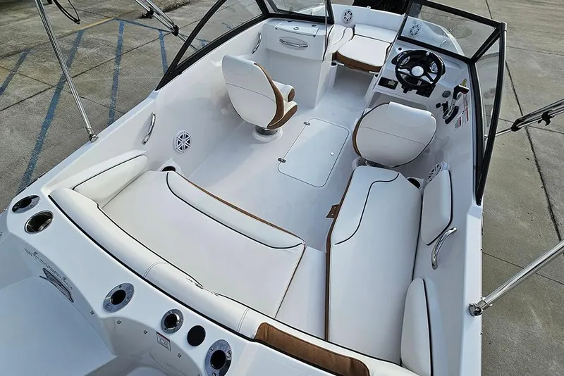 Slide: The Image of 2026 Stingray 191 DC boat with Suzuki outboard motor on trailer. - 9
