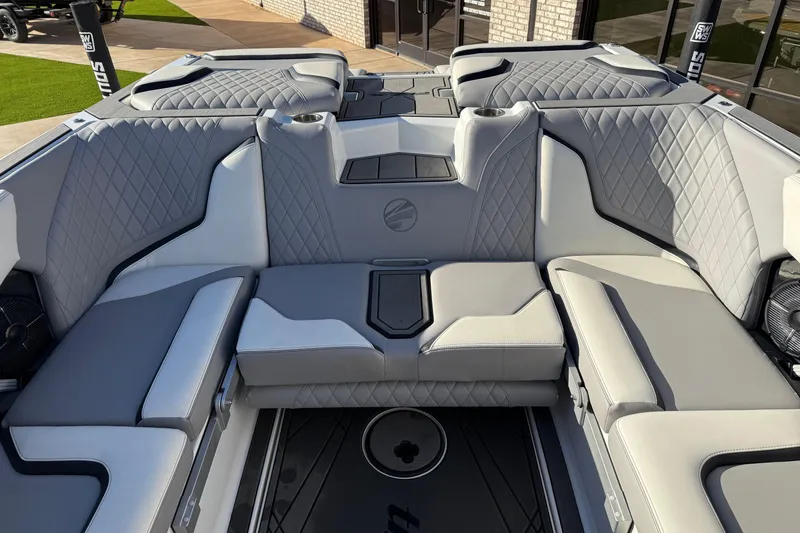 Slide: The Image of Luxurious interior of 2022 Tigé 24RZX boat with diamond-stitched seating and cup holders. - 15