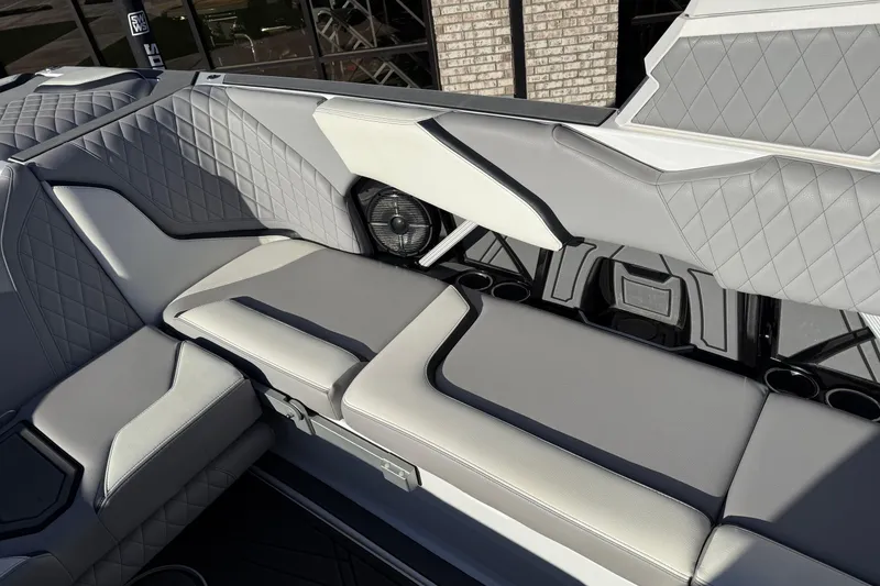 Slide: The Image of 2022 Tigé 24RZX boat interior with luxurious gray seating and diamond stitching. - 18