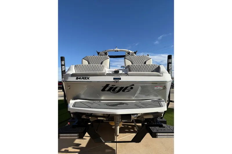 Slide: The Image of 2022 Tigé 24RZX boat rear view with sleek design and dual seating. - 6