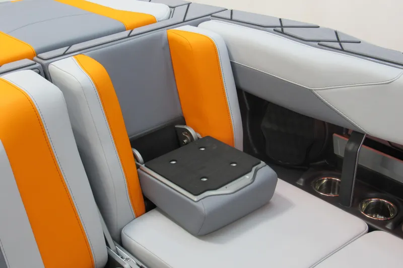 Slide: The Image of 2026 Malibu Wakesetter 23 LSV interior with orange and gray seating detail. - 11