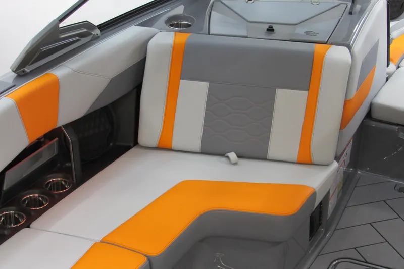 Slide: The Image of 2026 Malibu Wakesetter 23 LSV interior with orange and gray seating. - 13