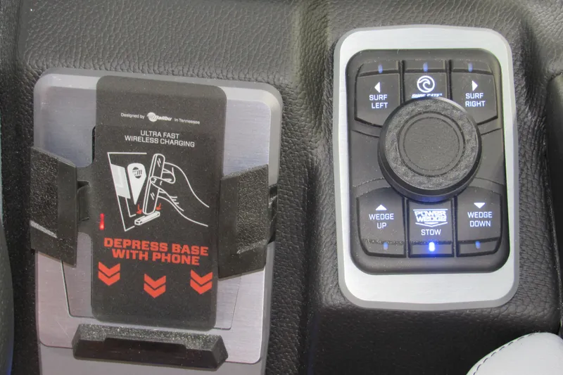 Slide: The Image of 2026 Malibu Wakesetter 23 LSV control panel with wireless charging and surf settings. - 14