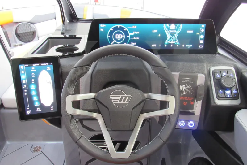 Slide: The Image of 2026 Malibu Wakesetter 23 LSV dashboard with advanced digital controls and steering wheel. - 16