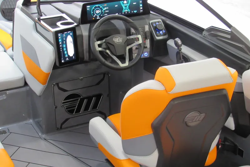 Slide: The Image of 2026 Malibu Wakesetter 23 LSV interior with modern dashboard and orange-accented seating. - 5