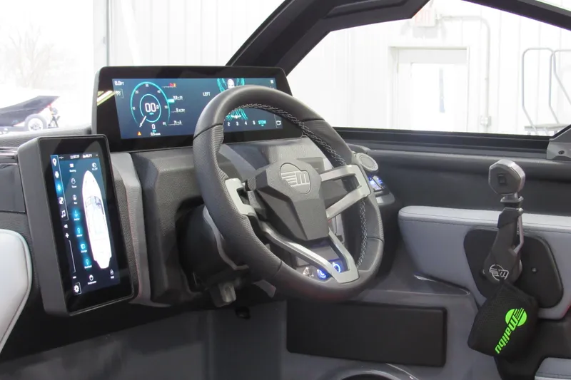 Slide: The Image of 2026 Malibu Wakesetter 23 LSV dashboard with advanced digital displays and steering wheel. - 6