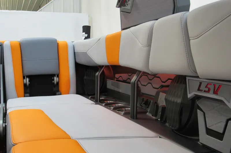 Slide: The Image of 2026 Malibu Wakesetter 23 LSV interior with orange and gray seating. - 8