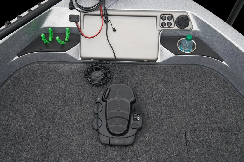 Slide: The Image of 2026 Ranger 1880MS boat interior with gray seating and carpeted deck. - 19