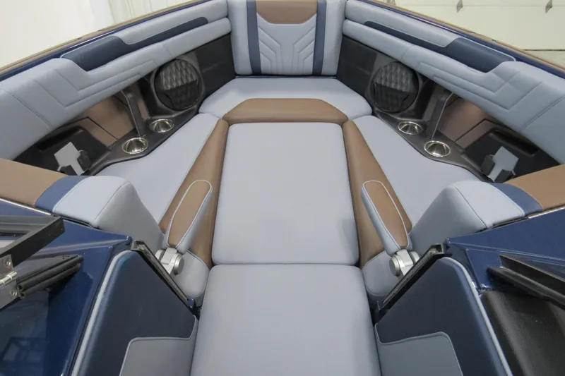 Slide: The Image of 2026 Malibu Wakesetter 25 LSV interior with luxurious seating and cup holders. - 10