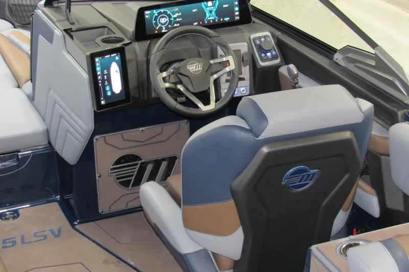 Slide: The Image of Interior of 2026 Malibu Wakesetter 25 LSV boat with modern dashboard and steering wheel. - 14