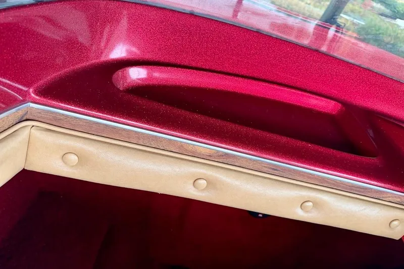 Slide: The Image of 1981 Glastron/Carlson C-512 boat interior with red metallic finish and beige upholstery. - 15