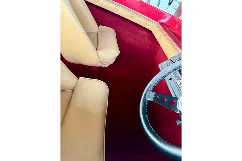 Slide: The Image of 1981 Glastron/Carlson C-512 interior with red carpet and tan seats. - 18