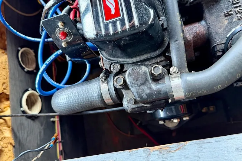 Slide: The Image of Close-up of a 1981 Glastron/Carlson C-512 engine with visible wiring and components. - 28