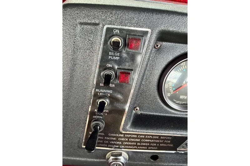 Slide: The Image of 1981 Glastron/Carlson C-512 dashboard with bilge pump and blower switches. - 31