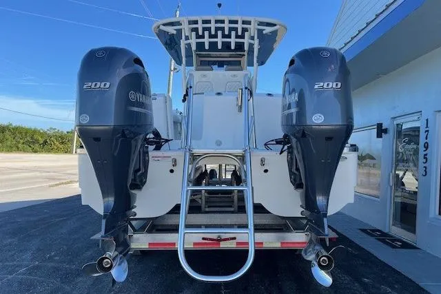 Slide: The Image of 2020 World Cat 280 CC-X boat with twin Yamaha 200 engines, rear view. - 2