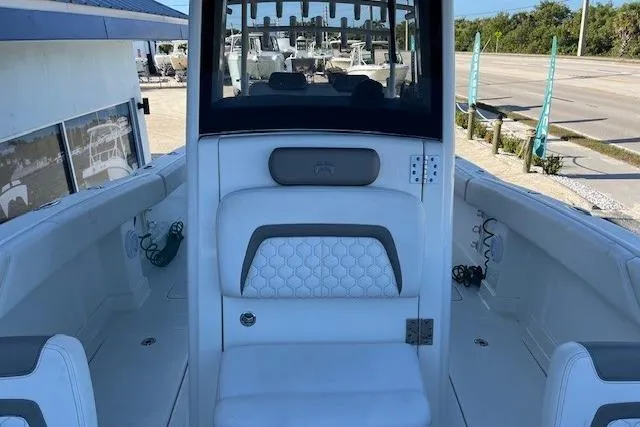 Slide: The Image of 2020 World Cat 280 CC-X boat interior with white seating and modern design. - 4