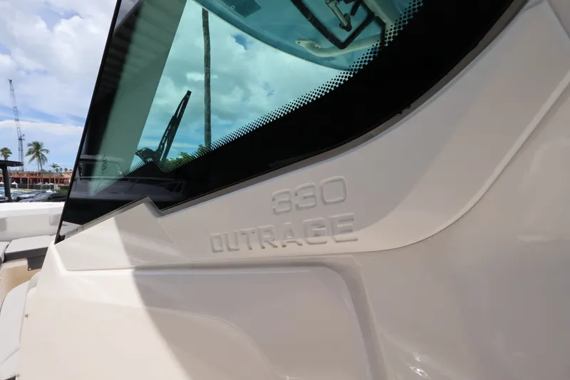 Slide: The Image of Close-up of the Boston Whaler 330 Outrage with sleek design and large windows. - 29