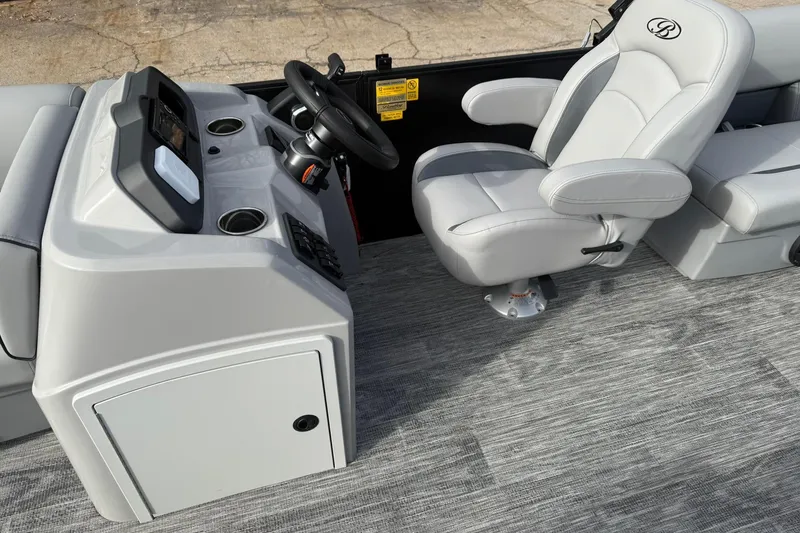 Slide: The Image of 2026 Bentley Pontoons Bolt 223 interior with steering console and captain's chair. - 10