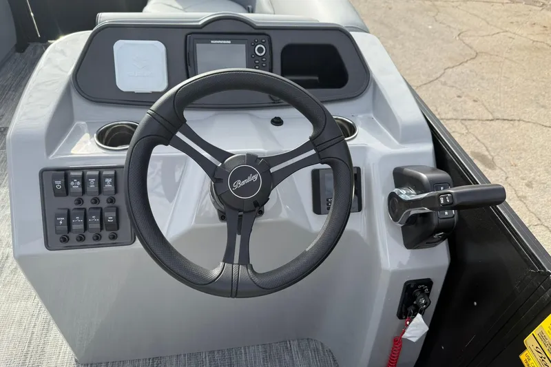 Slide: The Image of 2026 Bentley Pontoons Bolt 223 dashboard with steering wheel and control panel. - 11