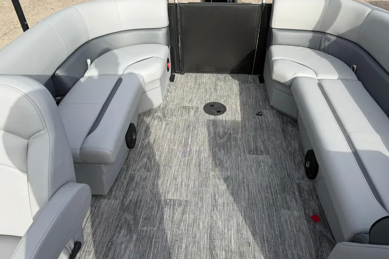 Slide: The Image of 2026 Bentley Pontoons Bolt 223 interior with gray seating and textured flooring. - 4