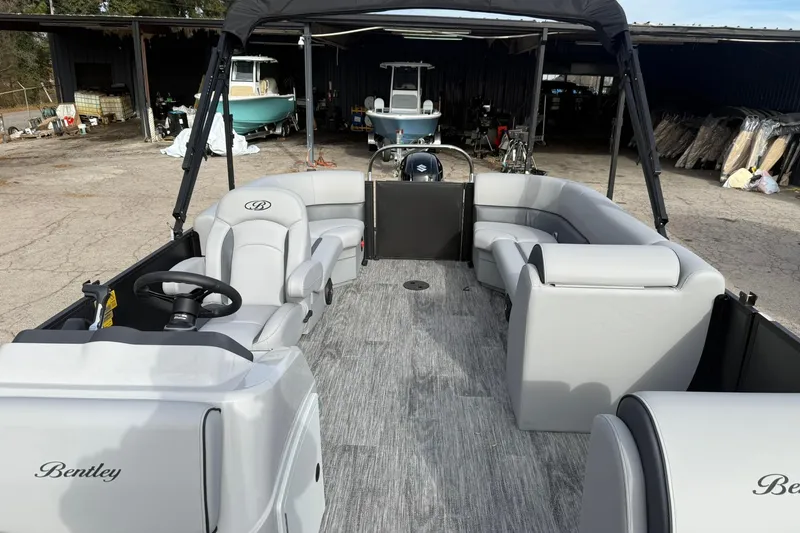 Slide: The Image of 2026 Bentley Pontoons Bolt 223 with sleek interior and modern design in a storage area. - 6