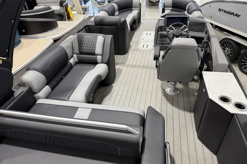 Slide: The Image of Luxurious interior of 2026 Avalon 2585 EXCALIBUR LTD FL pontoon boat with plush seating. - 2