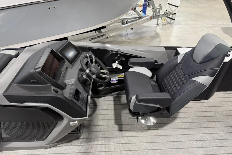 Slide: The Image of 2026 Avalon 2585 EXCALIBUR LTD FL boat cockpit with modern steering and luxurious seating. - 4