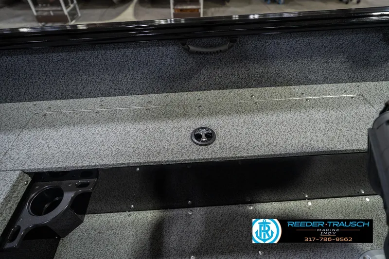 Slide: The Image of 2026 Lund 1700 Explorer SS boat interior with storage compartment and cup holder. - 24