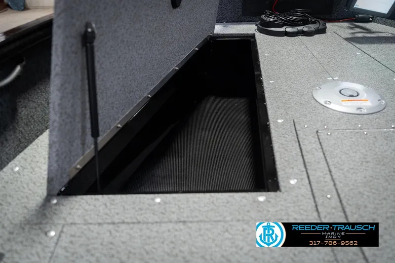 Slide: The Image of 2026 Lund 1700 Explorer SS boat storage compartment with open hatch. - 29