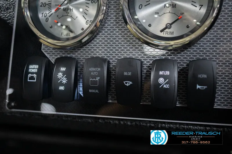 Slide: The Image of Dashboard controls of 2026 Lund 1700 Explorer SS boat with gauges and switches. - 35