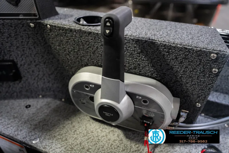 Slide: The Image of Throttle control of 2026 Lund 1700 Explorer SS boat, featuring textured dashboard. - 37