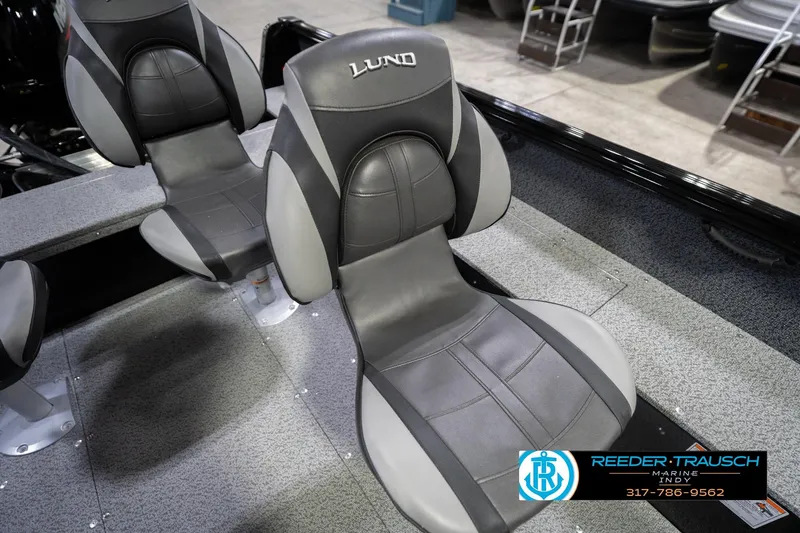 Slide: The Image of 2026 Lund 1700 Explorer SS boat seats, featuring sleek black and gray design. - 40
