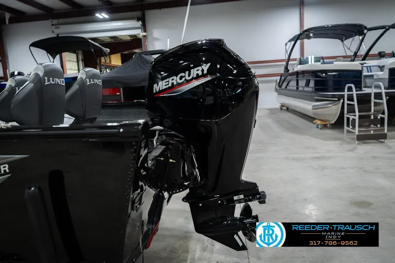 Slide: The Image of 2026 Lund 1700 Explorer SS with Mercury outboard motor in showroom. - 44